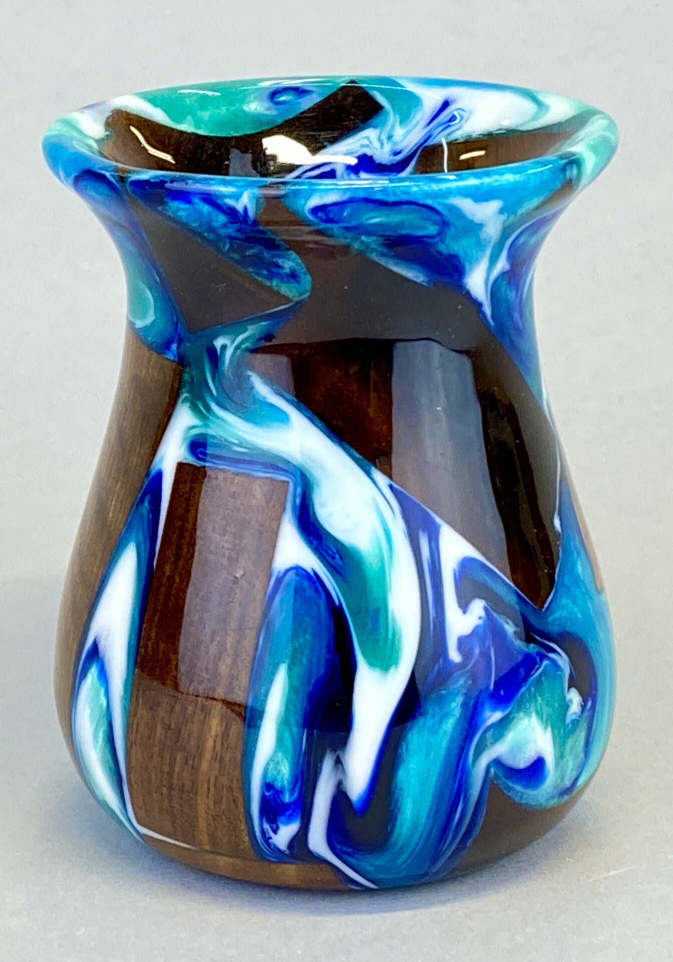 A vase with blue and white swirls on it.