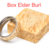 A wooden box with a ring on top of it.