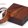 A wooden ring is shown on top of a box.