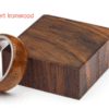 A wooden box with a metal ring on top of it.
