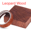 A wooden ring sitting next to a box.
