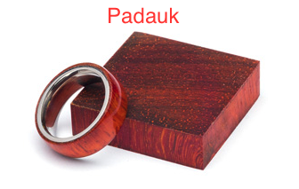 A wooden ring sitting on top of a piece of wood.