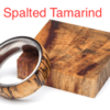 A wooden ring sitting on top of a block.