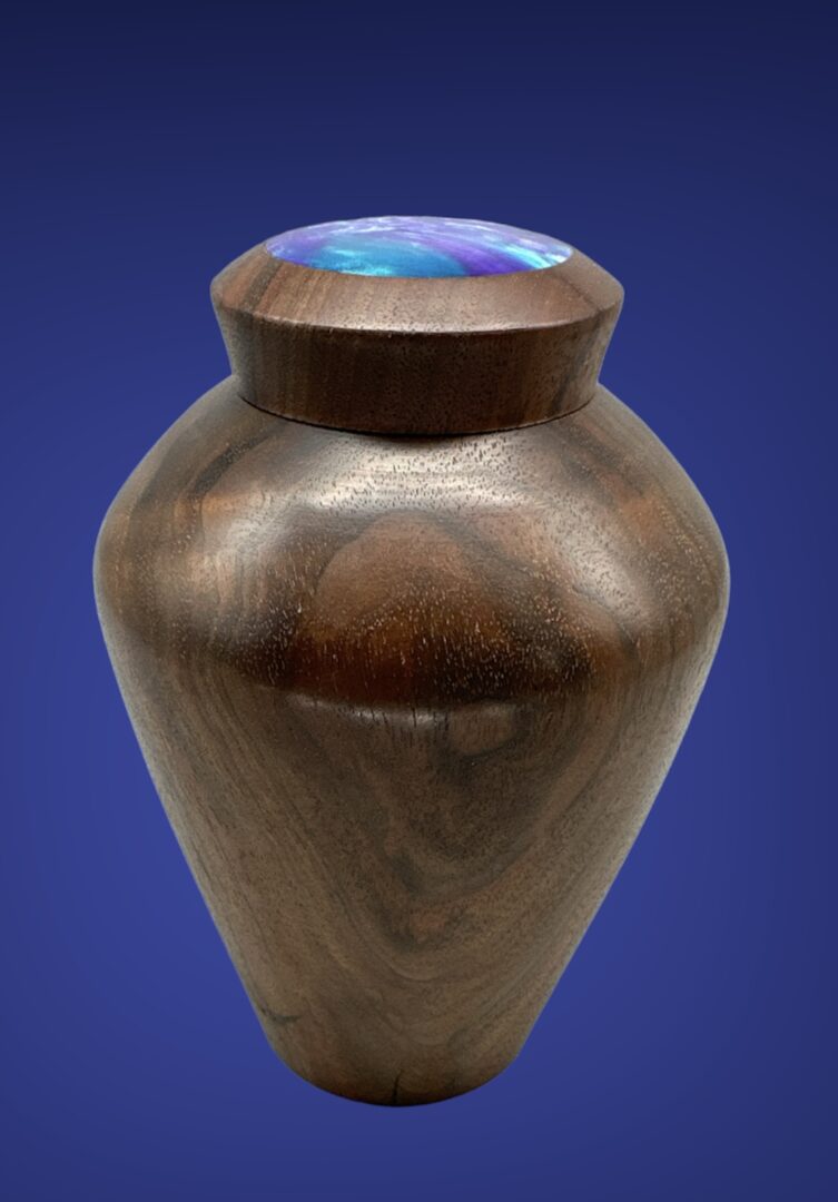 A wooden urn with a blue background