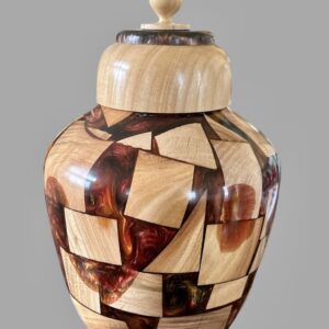 A wooden vase with a lid is shown.