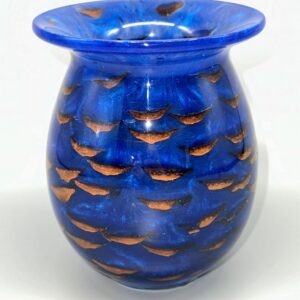 A blue vase with brown designs on it.